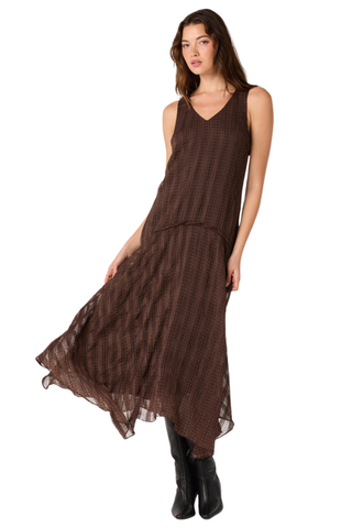 ASTR Halo Dress in Brown Plaid featuring a V-neckline, drop waist, and flowing asymmetric maxi hem.