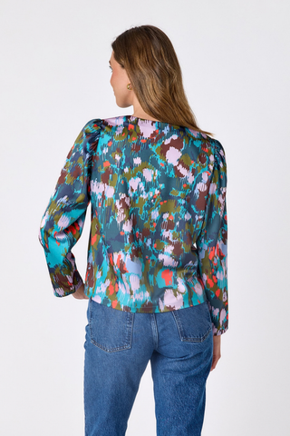 Crosby Jair Top in Florentine Marble featuring a multicolor abstract print, V-neckline, and long sleeves.