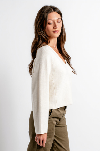 Kerisma Asima V Top in Cream featuring a V-neckline, relaxed cropped silhouette, and long sleeves.