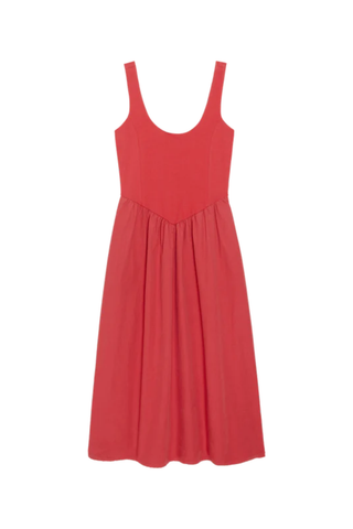 Woman wearing a red sleeveless midi dress with scoop neckline and gathered skirt from Nation styled with flat sandals.
