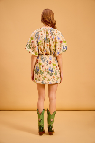 Olivia by Livro Delia Skirt in Chaparral featuring a relaxed mini silhouette and floral print.