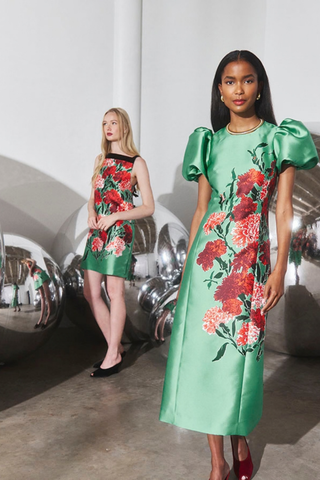 Hunter Bell Vesper Dress in Evergreen Conservatory featuring a fitted green floral midi silhouette with dramatic short puff sleeves.