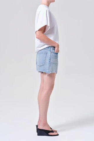 AGOLDE Nye Short in Post medium wash denim featuring a relaxed fit and longer inseam with a clean hem