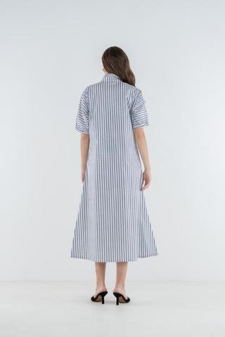 Model wearing the Emily McCarthy Poppy Maxi in Black Stripe with a relaxed maxi-length silhouette.