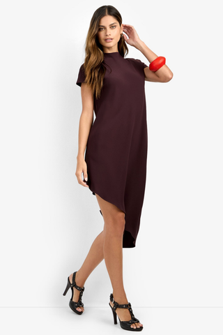 Trina Turk Shana 2 Dress in Cioccolato featuring a high neckline, short sleeves, and flowing asymmetrical midi hem.