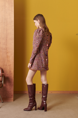 Celia B Alura Dress in a multicolor geometric print with long sleeves, statement puff shoulders, and mini length.