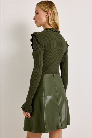 Tinley Turtleneck in Juniper Green featuring a fitted ribbed silhouette, long sleeves, and feminine ruffle trim at the neckline and shoulders.