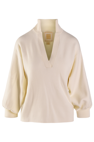 Emily McCarthy Lolli Sweater in Sandshell, a cream long sleeve sweater with a stand collar, V-neckline, and blouson sleeves.