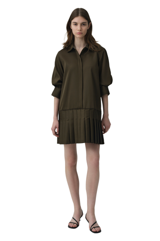SIMKHAI Regina Mini Dress in dark olive featuring a pointed collar, short puff sleeves, concealed button front, and pleated mini hem.