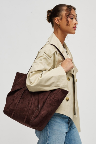 Urban Expressions Soren Tote in Chocolate brown vegan suede with long shoulder straps, bow-front detail, and matching zip pouch.