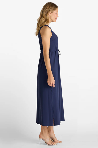 Woman wearing a navy blue dress on a white background