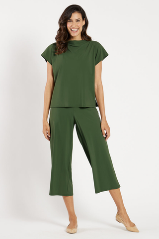 Model wearing the Jude Connally Tillie Top in Loden with a relaxed silhouette and cap sleeves.