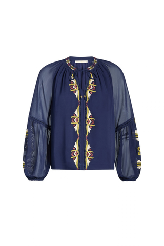 Marie Oliver Royce Blouse in Sundown featuring deep navy fabric, colorful embroidery, a tie neckline, and billowy sleeves.