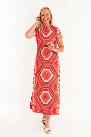 C.K. Bradley Malabar Dress in Kilim Maple red and orange geometric print with short sleeves and a straight maxi silhouette.