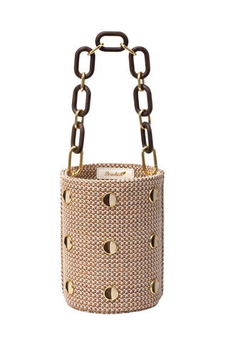 Brackish Greenwich Bucket Bag with woven textured exterior, gold bezel accents, feather inlays, and removable chain straps
