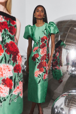 Hunter Bell Vesper Dress in Evergreen Conservatory featuring a fitted green floral midi silhouette with dramatic short puff sleeves.