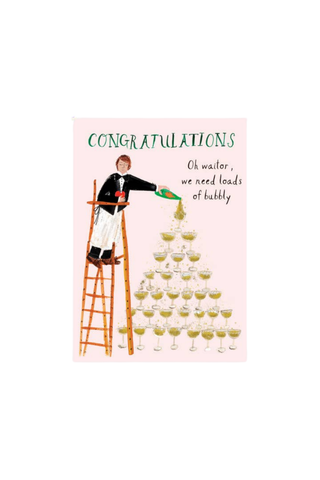 A congratulations card featuring a cartoon illustration of a waiter pouring champagne into a pyramid of glasses on a light pink background, with the text 'CONGRATULATIONS' and 'Oh wailor, we need loads of bubbly'.