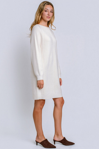 Kerisma Assima Sweater Dress in Cream featuring a relaxed mini silhouette, round neckline, and long sleeves.