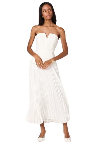 Woman wearing a white strapless midi dress with structured bodice and pleated skirt from ASTR on a white background.