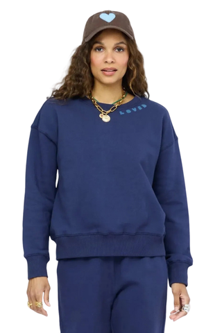 Kerri Rosenthal Ex-Boyfriend Sweatshirt in indigo blue featuring contrast heart elbow patches and a relaxed cotton fleece silhouette.
