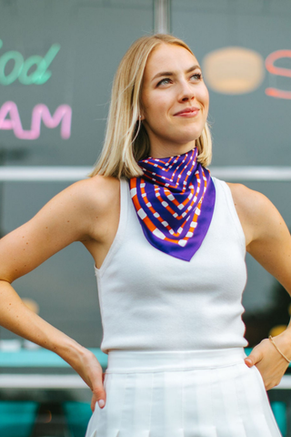 Swells Purple + Orange 26-inch silk scarf featuring a bold geometric print in purple, orange, and coordinating tones.