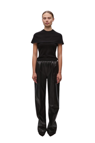 Black cape-style top with a modern tailored silhouette.