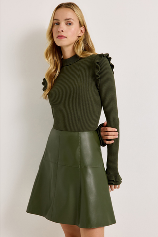 Tinley Turtleneck in Juniper Green featuring a fitted ribbed silhouette, long sleeves, and feminine ruffle trim at the neckline and shoulders.