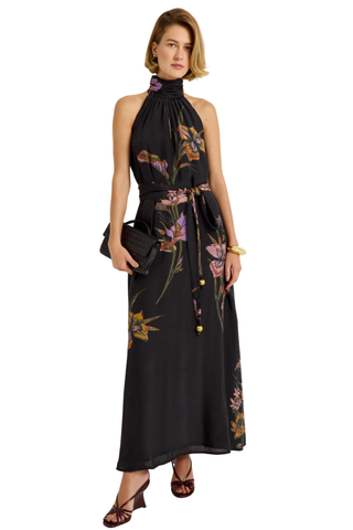 Penelope Dress in Nightshade featuring a black floral maxi silhouette, halter neckline, fluid A-line skirt, and optional sash belt.