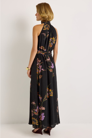 Penelope Dress in Nightshade featuring a black floral maxi silhouette, halter neckline, fluid A-line skirt, and optional sash belt.