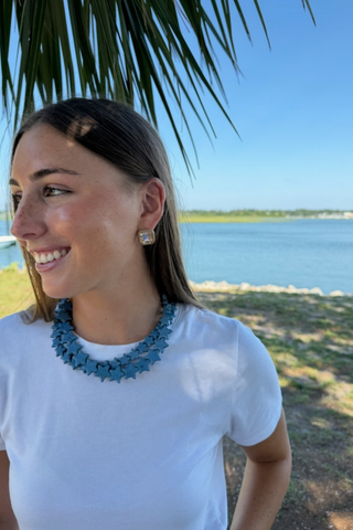 Smith & Co. Design Large Star Necklace in Dusty Blue featuring oversized muted blue star-shaped beads and a lobster clasp closure.