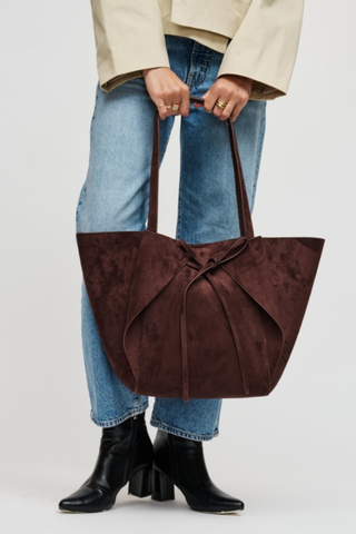 Urban Expressions Soren Tote in Chocolate brown vegan suede with long shoulder straps, bow-front detail, and matching zip pouch.