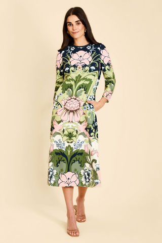 Mestiza Consuela Midi Dress in Eventide Gardens featuring a colorful botanical floral print, long sleeves, and a tailored midi silhouette.