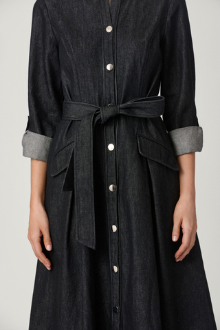 Shoshanna Izzy Dress in jet black featuring a button-front midi silhouette, collared neckline, long sleeves, and waist tie.