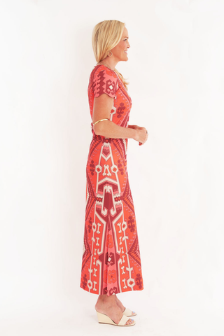 C.K. Bradley Malabar Dress in Kilim Maple red and orange geometric print with short sleeves and a straight maxi silhouette.