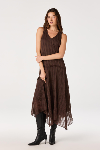 ASTR Halo Dress in Brown Plaid featuring a V-neckline, drop waist, and flowing asymmetric maxi hem.