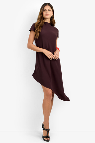 Trina Turk Shana 2 Dress in Cioccolato featuring a high neckline, short sleeves, and flowing asymmetrical midi hem.