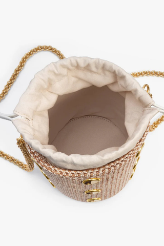 Brackish Greenwich Bucket Bag with woven textured exterior, gold bezel accents, feather inlays, and removable chain straps