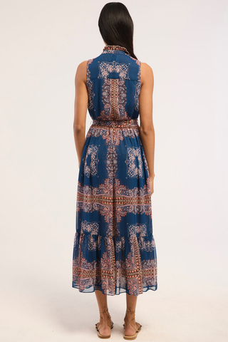 Blue printed chiffon midi dress with ruffle trim, button front, and tie waist.