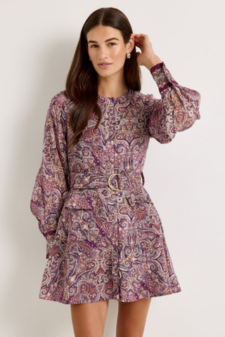Marie Oliver Hughes Dress in Wisteria featuring a purple paisley print, long sleeves, patch pockets, and optional waist belt.