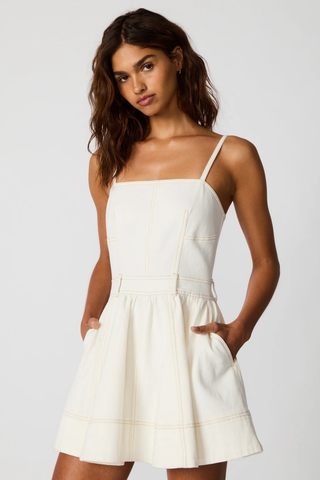 Steve Madden Aretha mini dress in Antique cream denim featuring contrast stitching, adjustable straps, and a flared skirt silhouette
