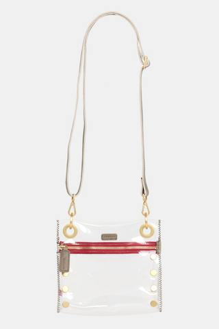 Hammitt Tony Small Clear Crossbody in Pew/Brushed Gold Red Zip featuring clear TPU construction, brushed gold hardware, and a red zipper accent.