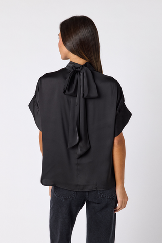 Crosby Lillian Top in Black featuring a high tie neckline, statement short sleeves, and relaxed blouse silhouette.