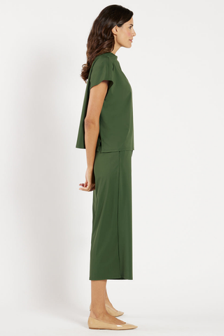 Model wearing the Jude Connally Tillie Top in Loden with a relaxed silhouette and cap sleeves.