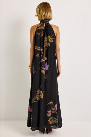 Penelope Dress in Nightshade featuring a black floral maxi silhouette, halter neckline, fluid A-line skirt, and optional sash belt.