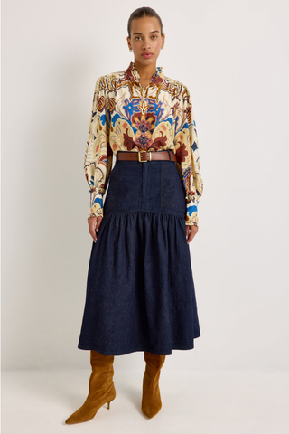 Montana Blouse in Rodeo featuring a colorful Western-inspired print, button front, ruffled collar and cuffs, and voluminous long sleeves.