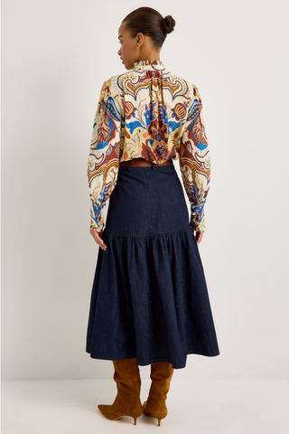 Montana Blouse in Rodeo featuring a colorful Western-inspired print, button front, ruffled collar and cuffs, and voluminous long sleeves.