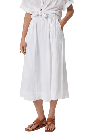 Model wearing the Lilla P Voile Circle Skirt in White featuring a midi length, elastic waistband, lightweight cotton voile fabric, and relaxed A-line silhouette paired with brown leather sandals