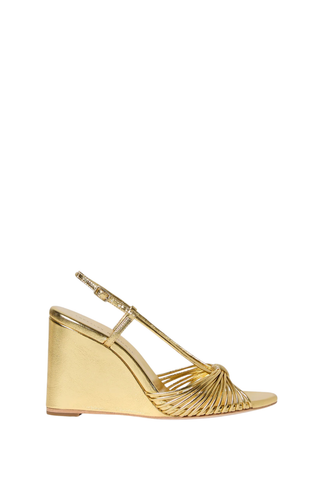 Loeffler Randall Marren Wedge in gold metallic leather featuring knotted mignon toe straps, slingback strap, open toe, and 3.5-inch wedge heel