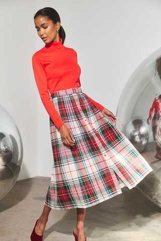 Hunter Bell Harlan Skirt in Kensington Plaid Crimson featuring a pleated midi silhouette, multicolor plaid pattern, and gold front buttons.