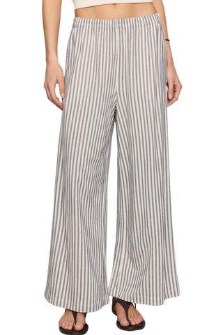 Model wearing the Z Supply Scout Knit Striped Pant in Eclipse featuring a high-rise waist, wide-leg silhouette, and striped knit fabric.
